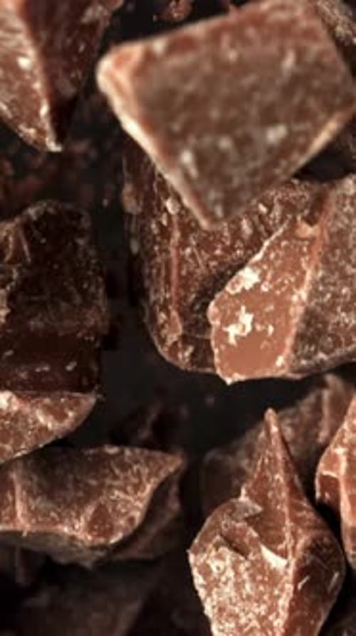 Super Slow Motion Pieces of Dark Milk Chocolate Filmed on a Highspeed Camera at 1000 Fps
