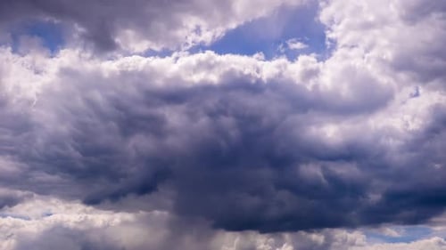 Time Lapse of Dark Storm Clouds and Blue Sky