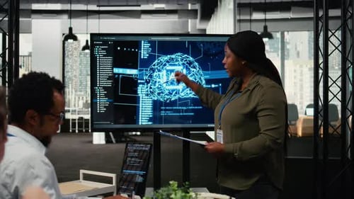 Team Discussing Artificial Intelligence on Screen in Office