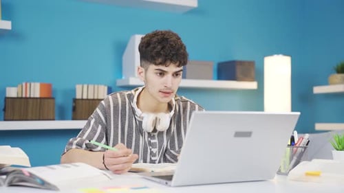 The student, who is surprised by what happens on the laptop while studying, gets angry and leaves.