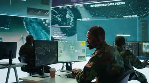 Soldiers in State of the Art Military Control Room Collaborate on Data Analysis