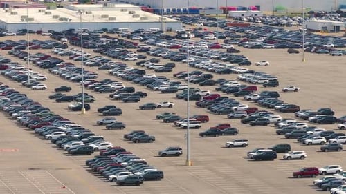 New Cars Parked for Sale on Automotive Factory Parking Lot Dealer Vehicle Inventory for Import and