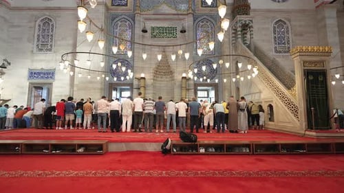People Worshiping in a Beautiful Mosque