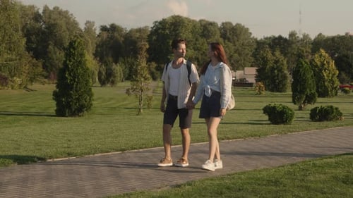 Couple Walking In Park