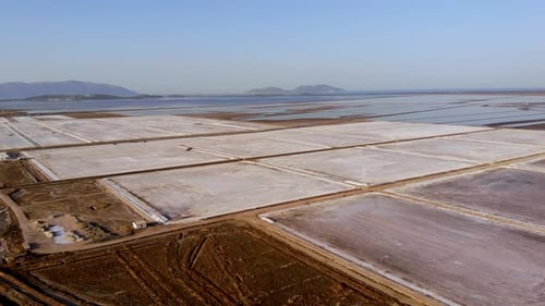 View of a Salt Flat Factory Besides the Sea Drone Shot of Salt Extraction