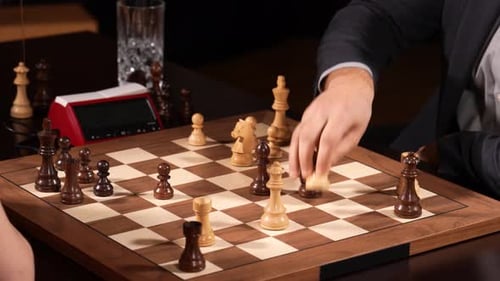 Woman attacks man in chess game match. Closeup lockdown shot
