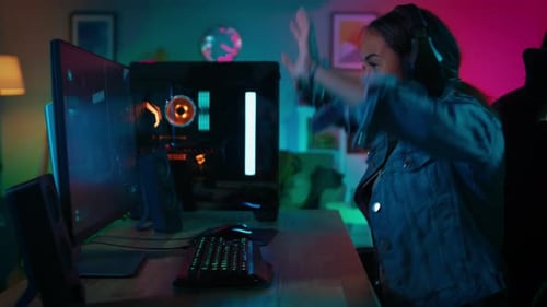 Enthusiastic Woman Plays Video Game in her Room