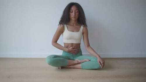Yoga teacher shows different lotus breathing techniques with one or two hands