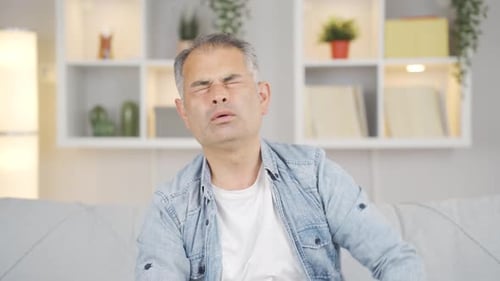 Man with migraine is experiencing pain.
