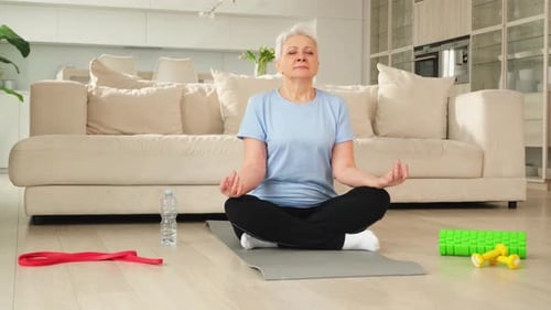 Senior Woman Practicing Yoga at Home