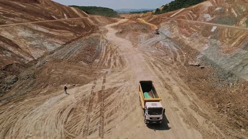 Truck Driving Along A Dirt Road