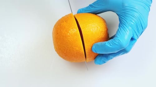Ripe Bright Orange Cut Close Up on Kitchen Board