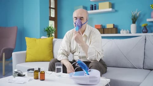 Homme ayant une respiration sifflante utilisant un respirateur.