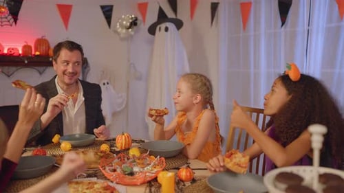 Family Celebrates Halloween with Pizza Party