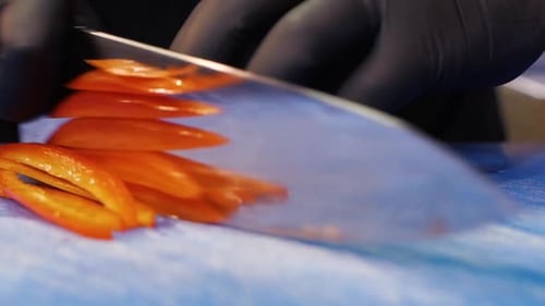 Slicing Orange Bell Pepper with Sharp Knife