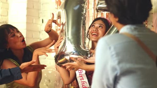 Friends Celebrate a Birthday with Balloons and Cheer