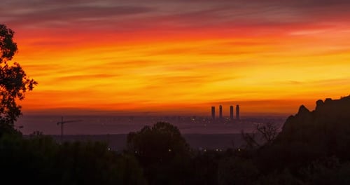 Timelapse of a beautiful sunrise in Madrid, Spain. Madrid skyline and colorful clouds at sunrise.