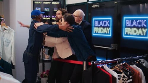 Shoppers Pushing Security Guard During Black Friday Sale