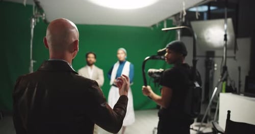People Working Together in Film Studio with Green Screen