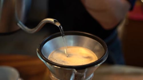 Pouring Hot Water to Brew a Coffee at Home