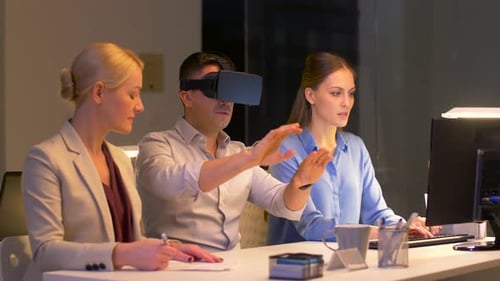 Team Works With Virtual Reality in Modern Office