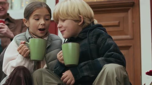 Cozy Children and Grandfather Drinking Warm Drinks