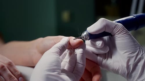 Manicurist Polishes Skin Nail Art Master Uses a Drill Machine to Remove the Skin From the Cuticles