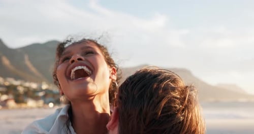 Romantic Couple Embracing on a Beach at Sunset