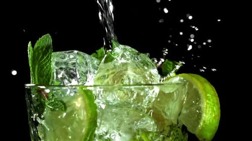 The Mojito Cocktail is Poured Into a Glass Filmed on a Highspeed Camera at 1000 Fps