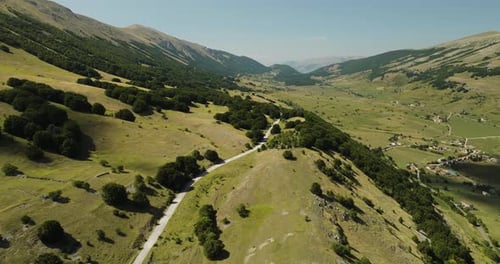 Aerial view of mountains and valley, Italy.