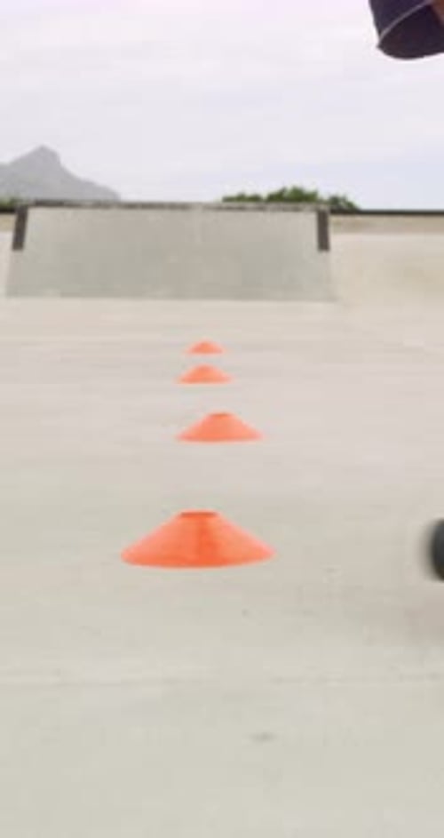 Roller skates, park and cones for practice with legs, balance and outdoor in summer in urban town