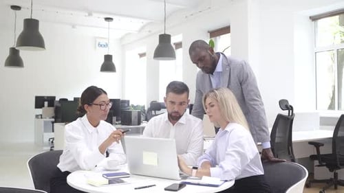 Multiethnic Business People During Meeting in Modern Office