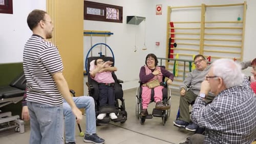 Physical Therapy Group Exercises with Patients in Rehabilitation Center