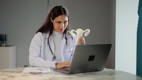 Woman Doctor Explains Uterus Anatomy During Telehealth Appointment