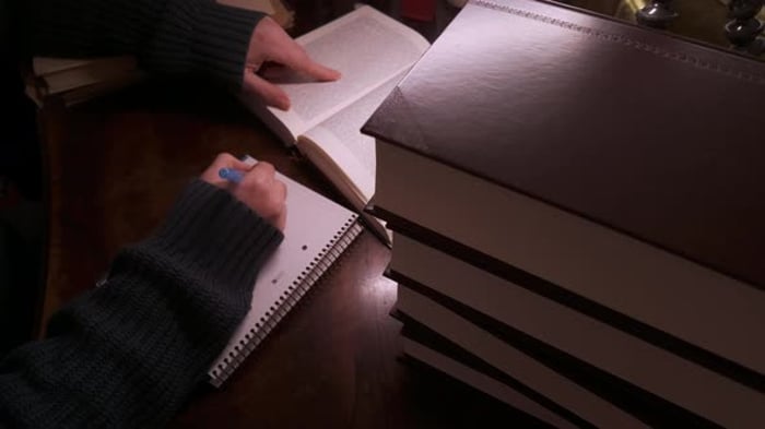 Person Writes in Notebook with Book, People Stock Footage ft. studying ...