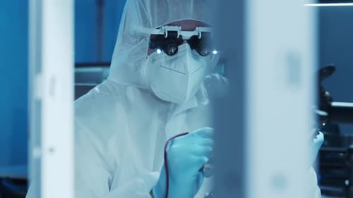 Microelectronics Engineer Works in a Modern Scientific Laboratory on Computing Systems and