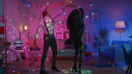 Romantic Couple at Home: Beautiful Young People, Boy and Girl Dancing Slowly in the Living Room. St