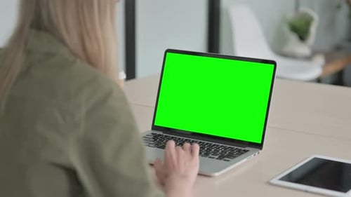 Blonde Woman Using Laptop with Green Screen
