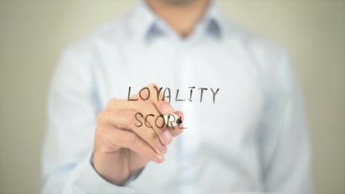 Loyality Scores Man Writing on Transparent Screen