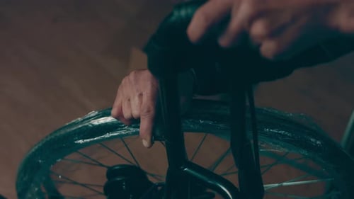 A Disabled Man Assembles a Stroller