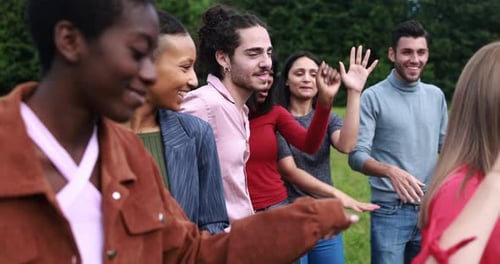 Diverse Group Dancing in Urban Park Having Fun