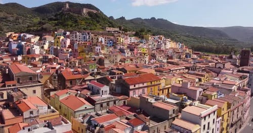 Experience Bosa, Sardinia from a stunning aerial perspective, highlighting the town's proximity to t