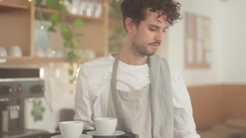 Coffee shop, waiter service and man with tray to serve customer, client