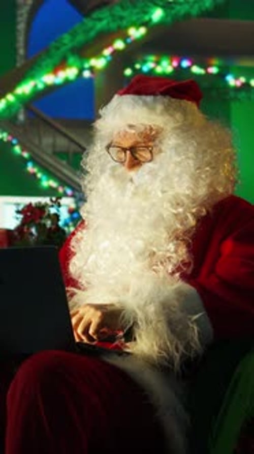Vertical Video Portrait of Santa Claus Bringing Positivity and Joy to Others Posting Online