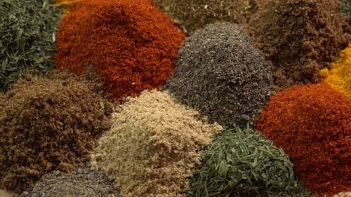 Spice and seasoning. Various fragrant spice market. Heap different Asian Spices rotated on wooden