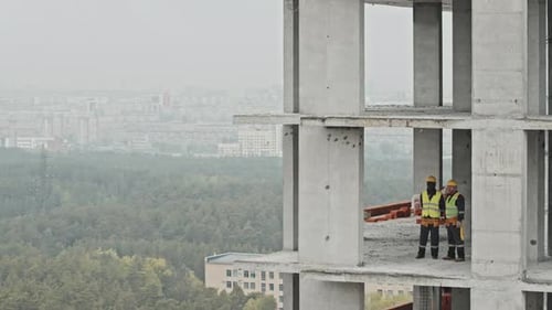 Two Men Co-working At Construction Site