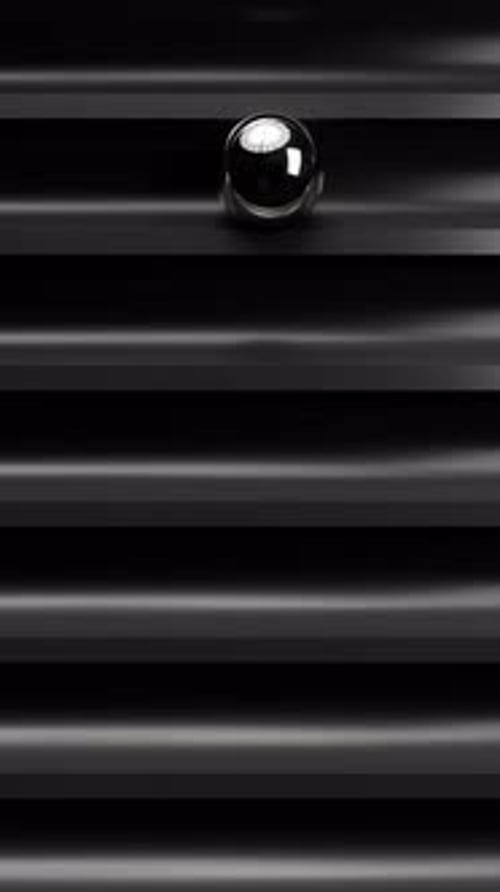 Abstract 3D Chrome Metal Ball Traveling Down Track Loop