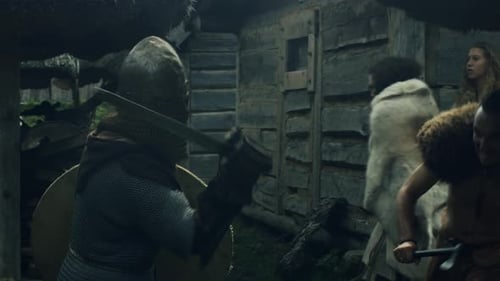 Warriors are Fighting during Attack on Civilian Village during Slavs and Vikings Festival. Medieval