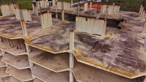 Aerial view of abandoned building revealing concrete structure and decay