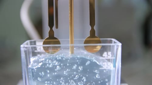 Electrolysis of Bubbling Liquid by Gold Prongs